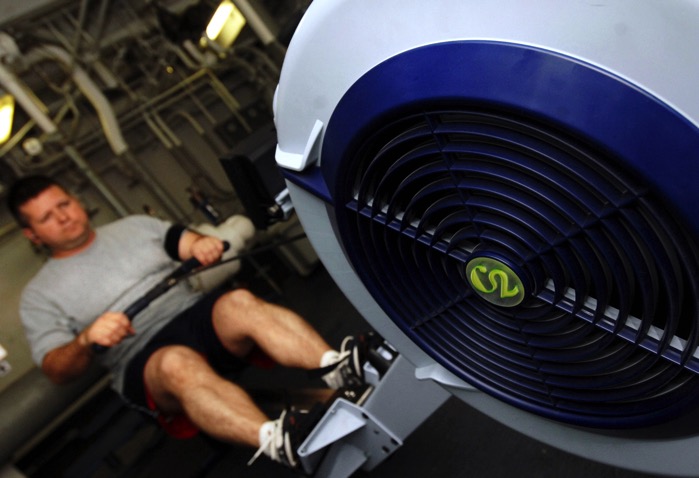 US Navy 070329 N 8923M 029 Lt Shaun Estep of Strike Fighter Squadron VFA 37 the Raging Bulls prepares for the physical readiness test PRT on a rowing machine